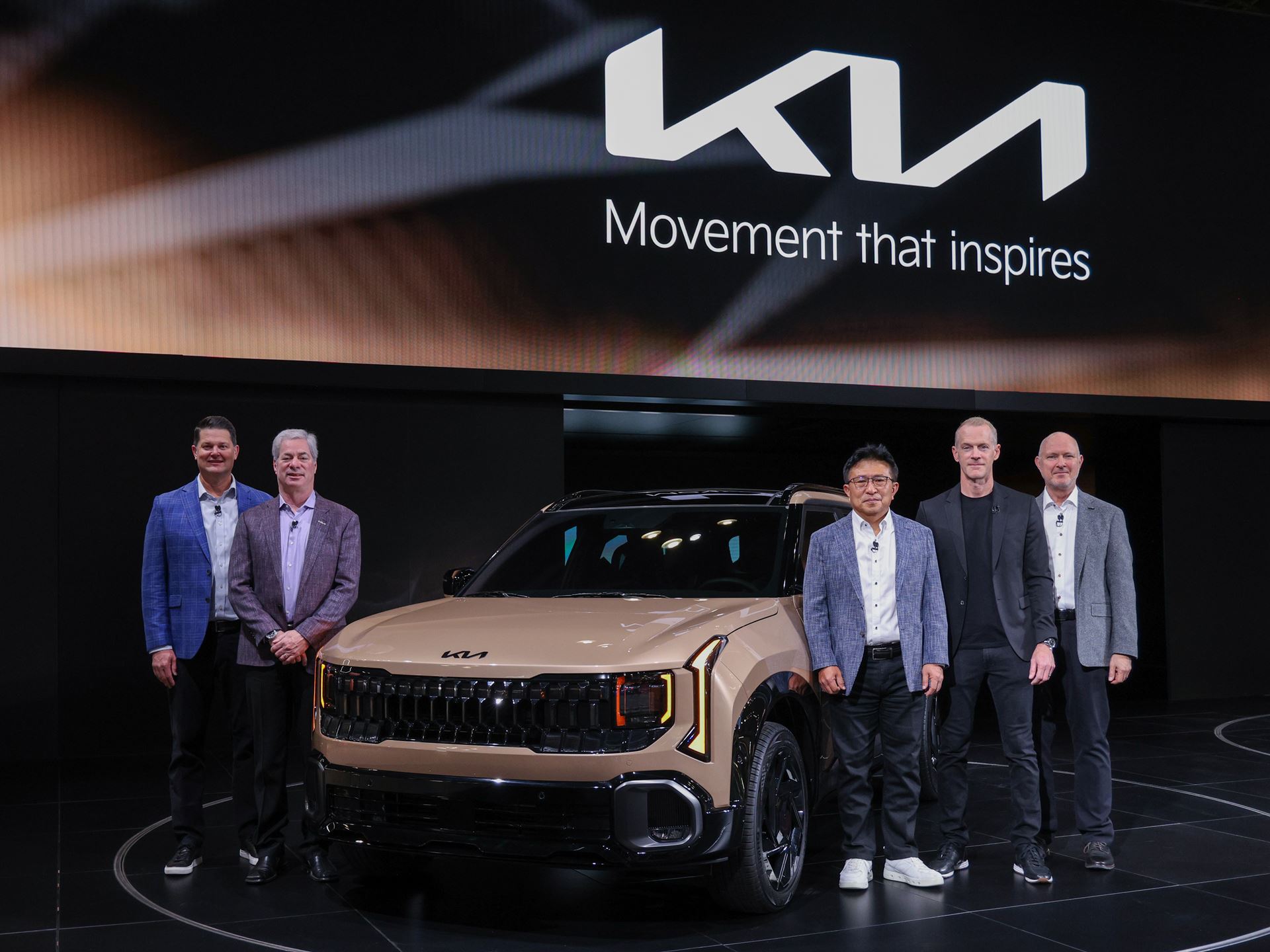 Kia North America executives gather for a commemorative photo in front of the Seltos X Line