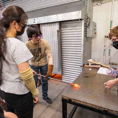 Dongheng Yang MFA 24 GL and Glass faculty member Jocelyne Prince MFA 94 GL at work in the Experiments in Optics studio.