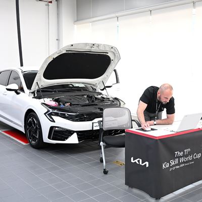 Kia Skill World Cup participant is taking vehicle practical test at Kia Osan Training Center, Korea