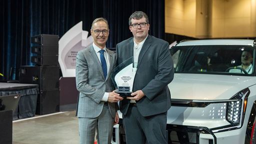 AJAC Award Acceptance Evan Willams with Kia Canada Director of Marketing Michael Kopke