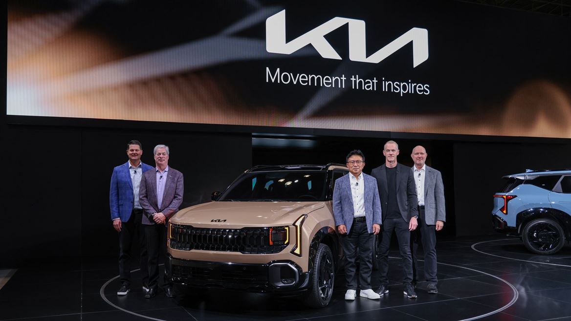 Kia North America executives gather for a commemorative photo in front of the Seltos X Line