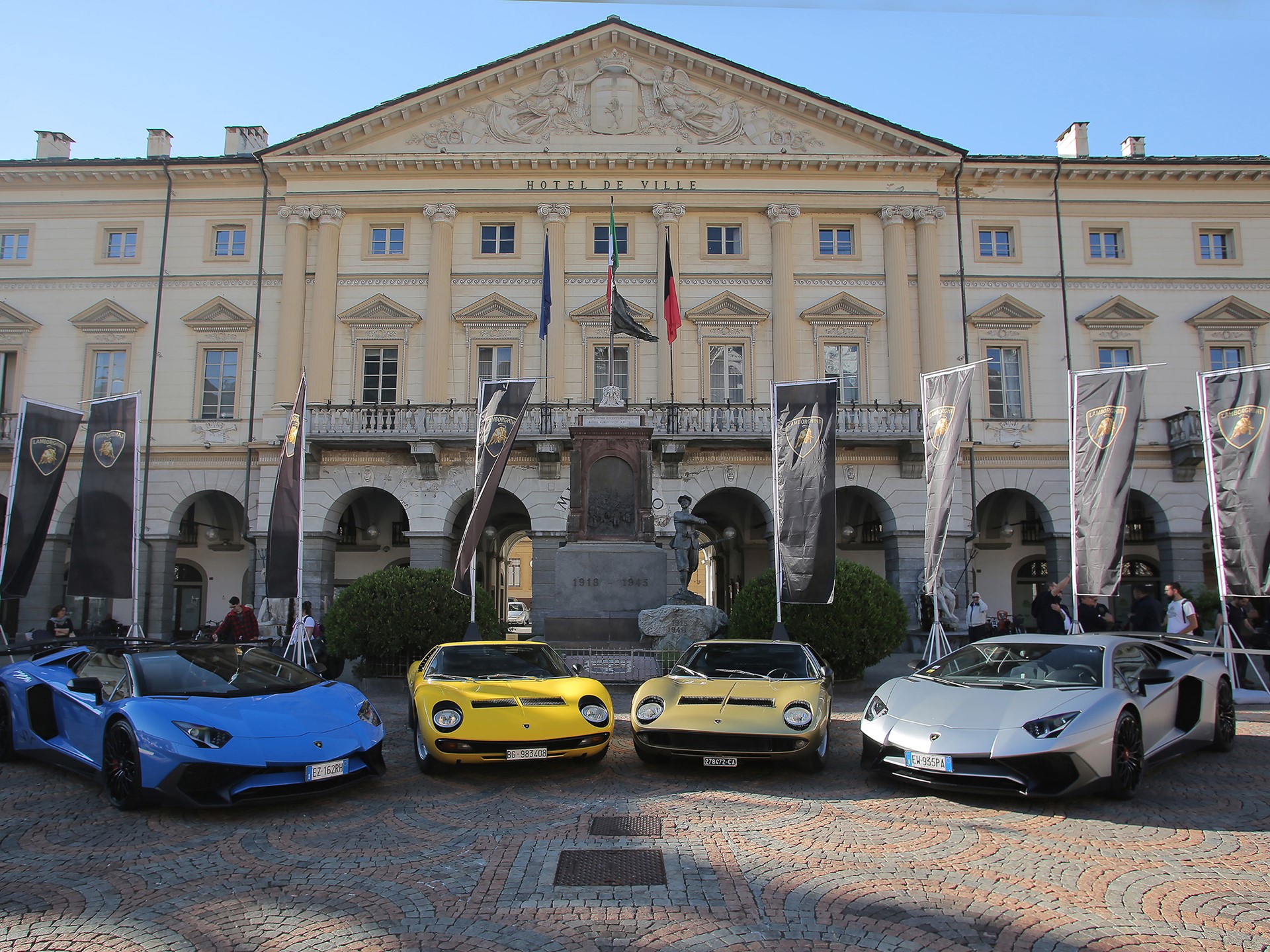 Polo Storico'S Three-Year Miura Sv Rebuild Shows Why Factory Certification Commands A Premium 17 Four lamborghini supercars lined up: two classic miuras and two aventadors in front of a historical building
