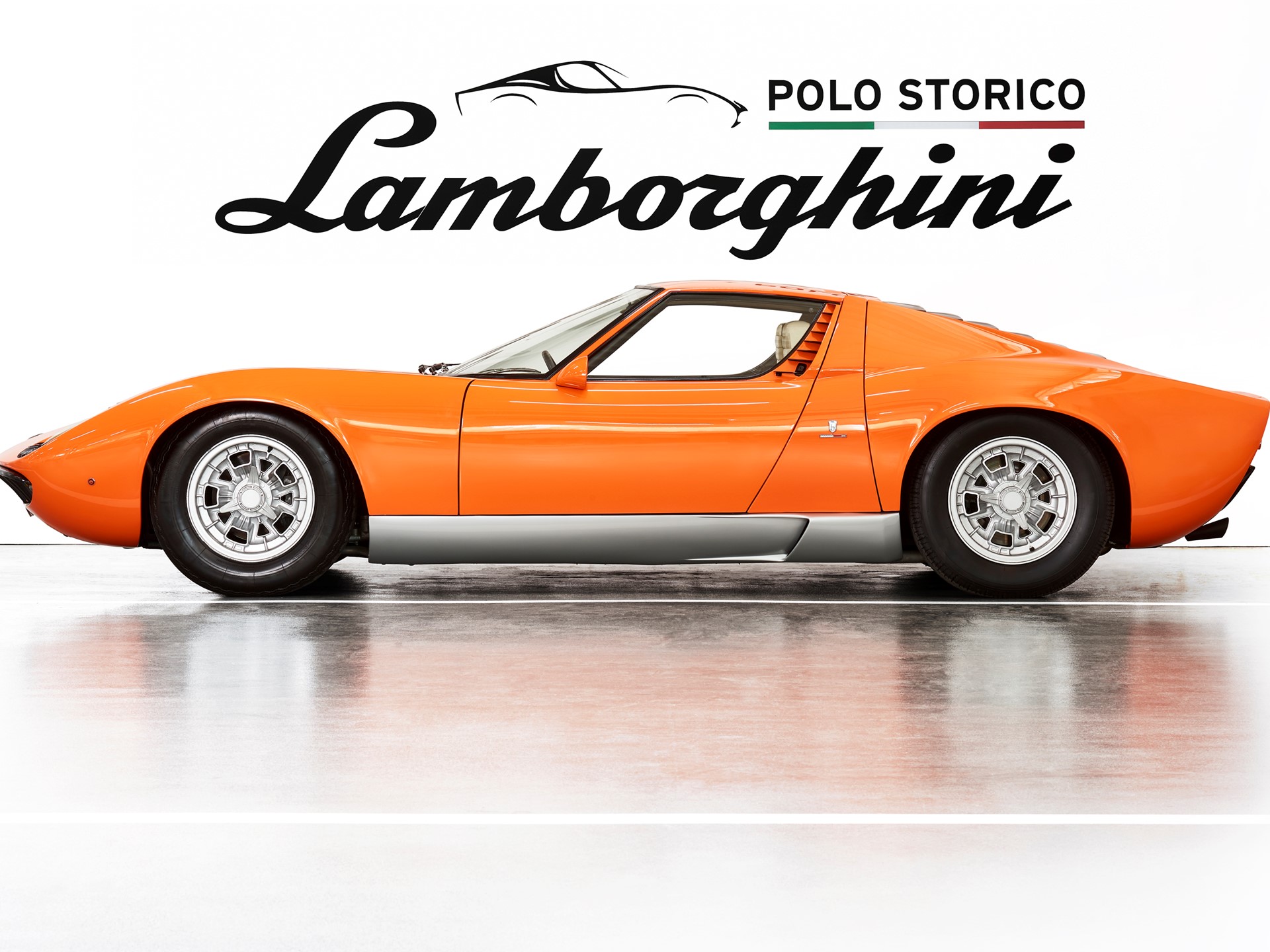 Polo Storico'S Three-Year Miura Sv Rebuild Shows Why Factory Certification Commands A Premium 7 Orange lamborghini miura in studio with polo storico lamborghini logo above