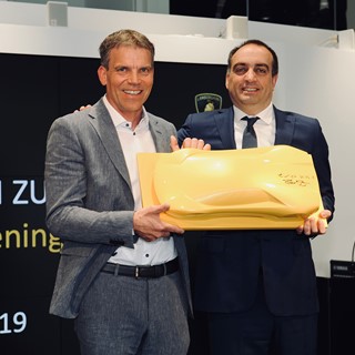 Lamborghini Zürich Grand Opening-Rene Hirsch,President Hirsch AG(left)receiving from Federico Foschini, Chief Commercial
