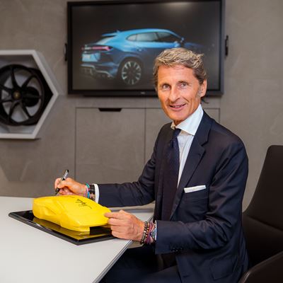 Stephan Winkelmann signing the inaugurtion present at Grand Opening Munich 2022