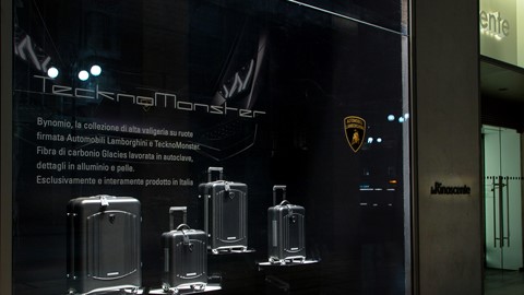 Automobili Lamborghini luggage by Tecknomonster at La Rinascente Milano by night