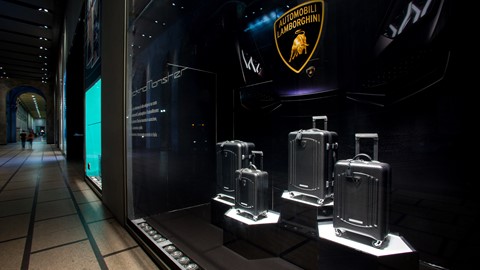 Automobili Lamborghini luggage by Tecknomonster at La Rinascente Milano by night