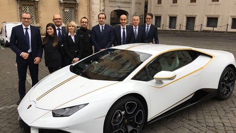S.Domenicali (left) with a delegation of Lamborghini Management Board and two factory workers