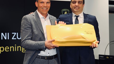 Lamborghini Zürich Grand Opening-Rene Hirsch,President Hirsch AG(left)receiving from Federico Foschini, Chief Commercial
